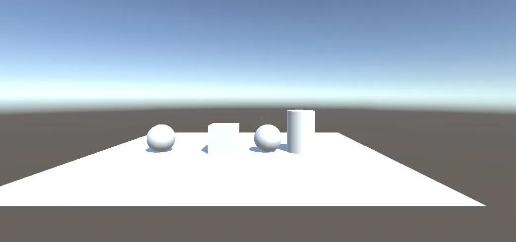 3D rendering of basic geometric shapes on a flat surface.