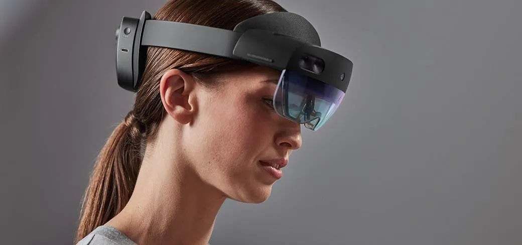Woman wearing augmented reality headset.