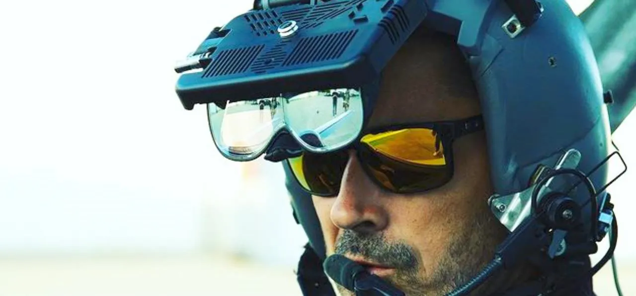 Military personnel wearing advanced helmet-mounted display and goggles.